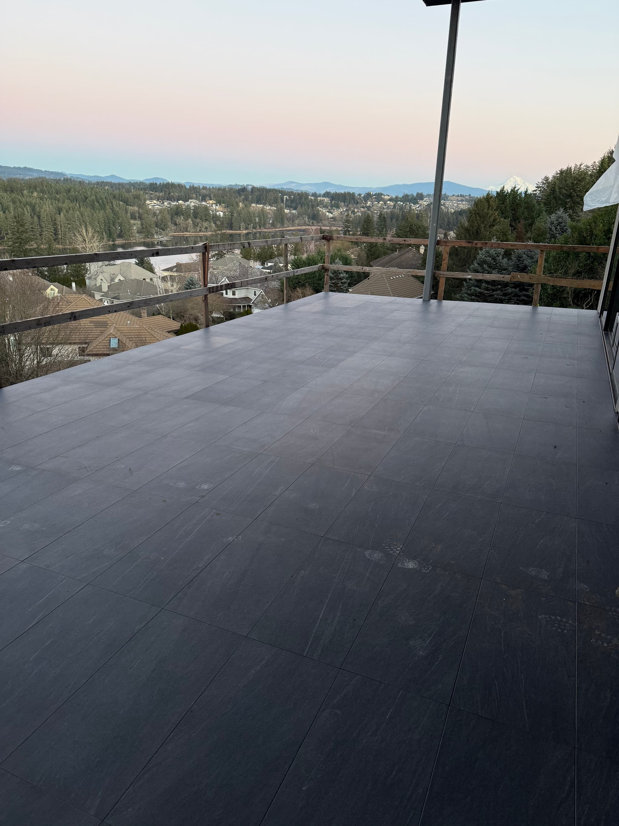 Elevated deck patio tile at dusk with lake view — Camas, WA