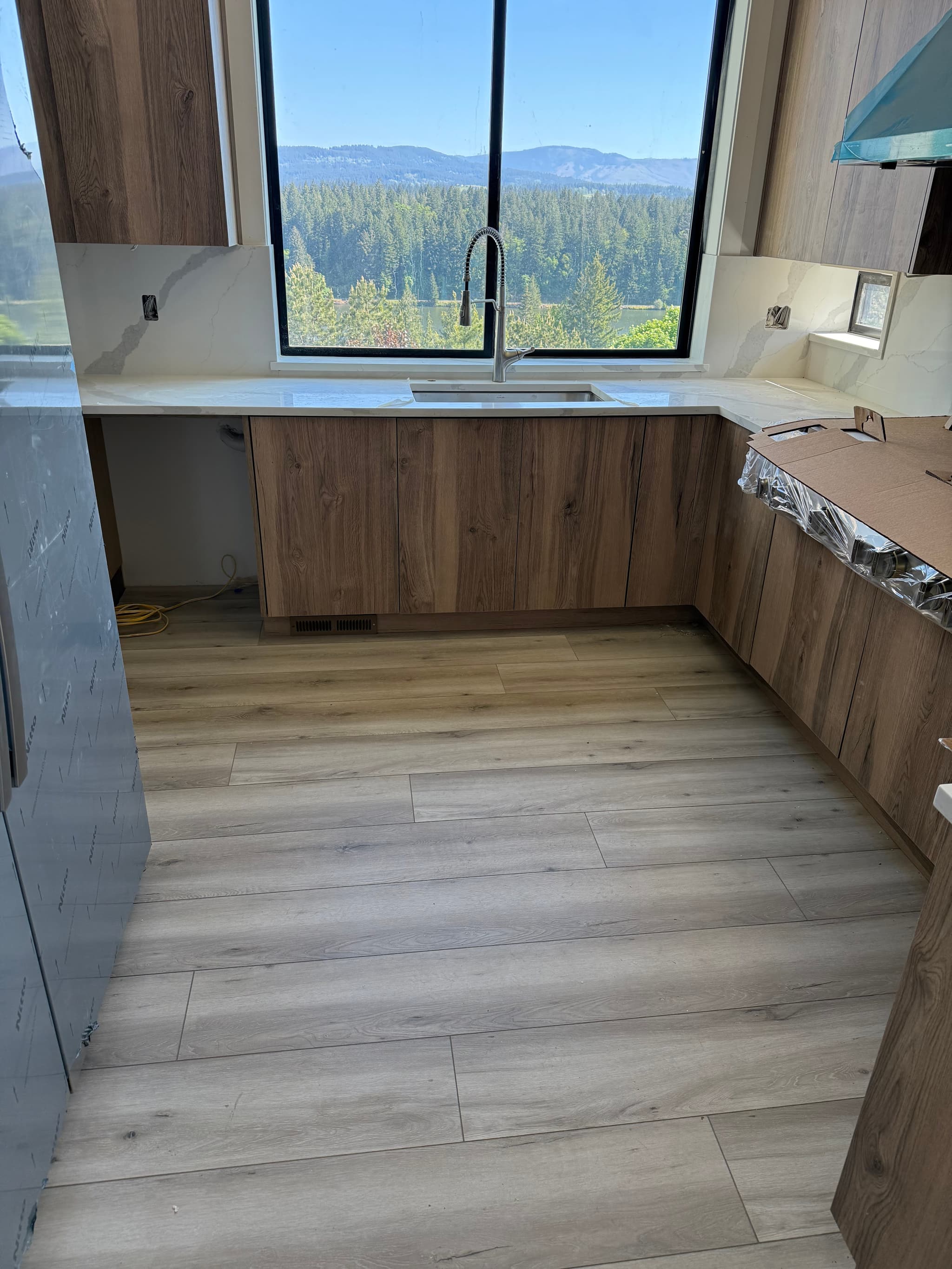 Kitchen window view over Lacamas Lake with laminate flooring — Camas, WA