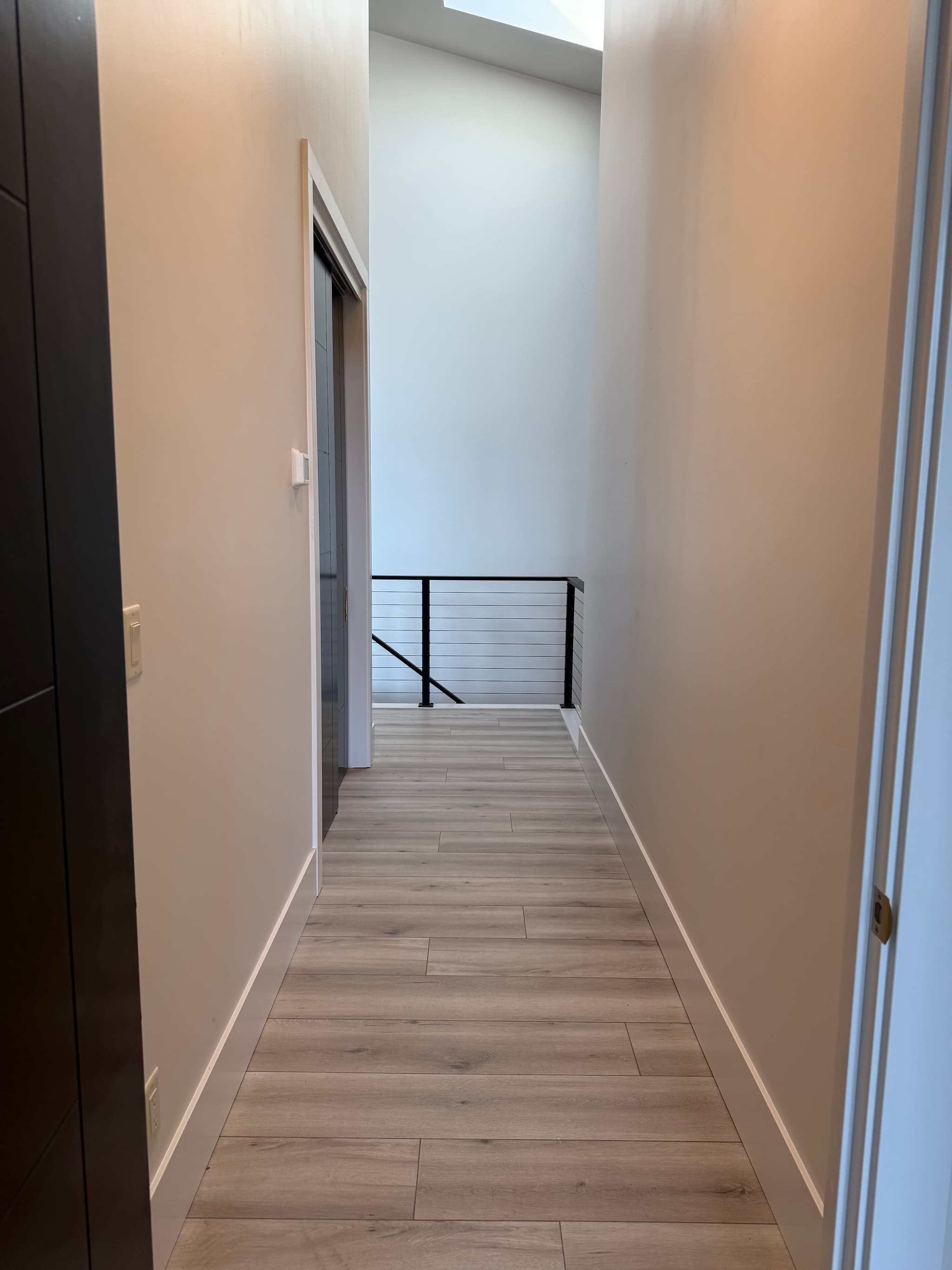 Stairwell landing with skylight and cable railing — Camas, WA