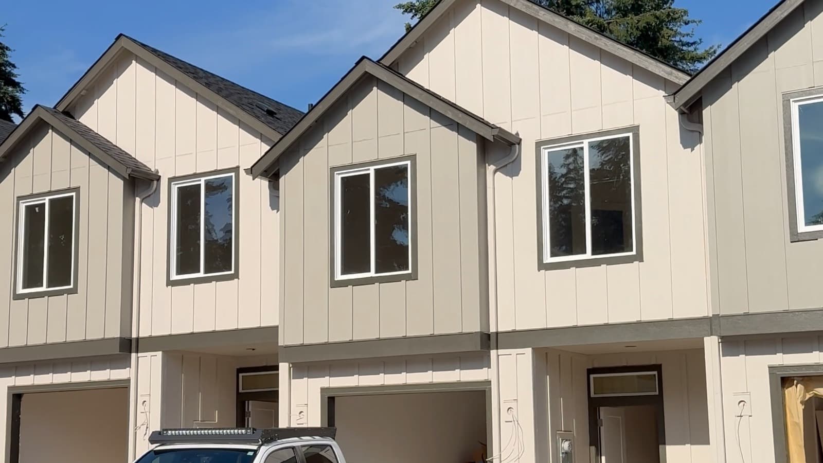 Row of new-construction townhomes with matching gable rooflines — Hazel Dell, WA